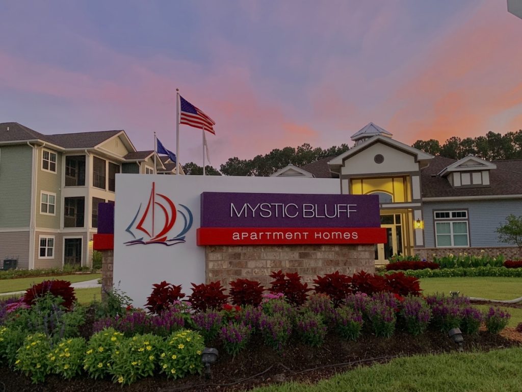 Apartment search at Mystic Bluff Apartments at dusk.