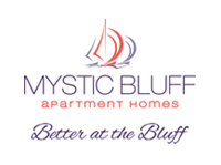 Apartments in Bluffton Logo for Mystic Bluff Apartment Homes with text "Better at the Bluff" and an image of two sailboats in red and gray.