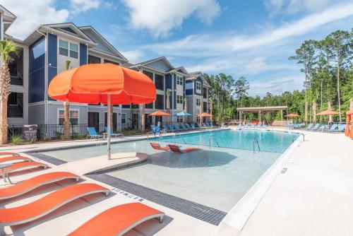 Apartments in Bluffton, SC - Community Pool with Sundeck and Tanning Shelf